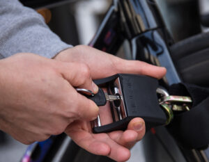 somone locking padlock on chainchain lock locking bikes front wheel