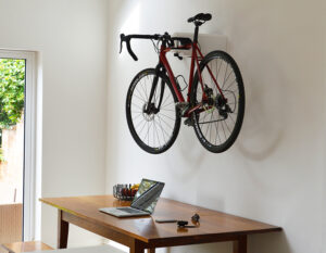 Road Bike in AIRLOK wallhanger over a desk inside a house