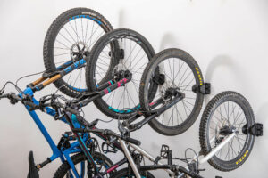 Multiple mountainbikes mounted vertically in JAW compact bike rack