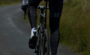 Cyclist wearing reflective Stolen Goat Leg Warmers