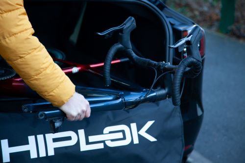Road bike being put into a car with Hiplok RIDE SHIELD 